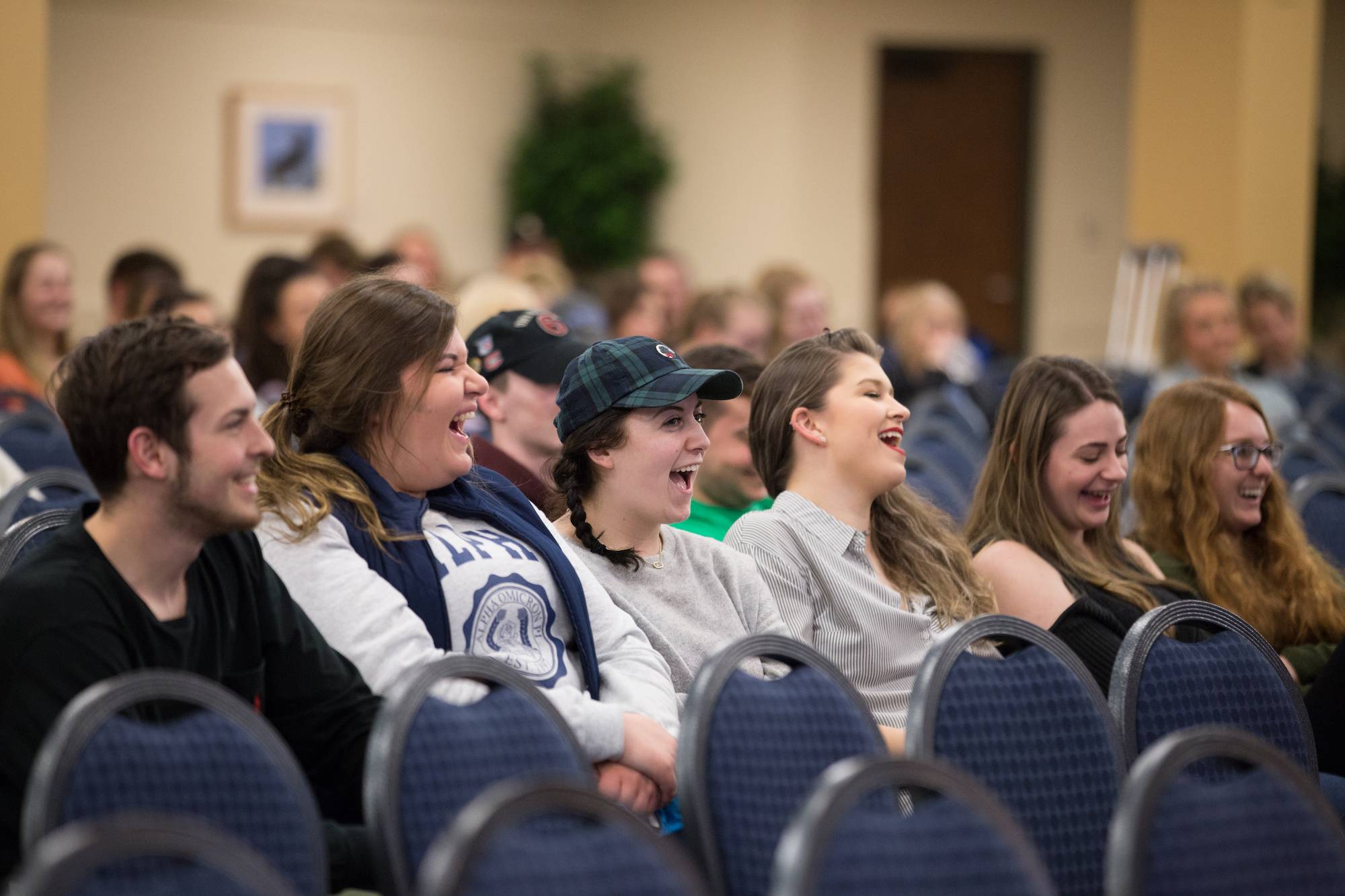 Students laughing in a line